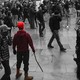 Elias Irizarry, highlighted in red, holding a metal pole in the US Capitol on January 6, 2021.