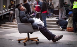 A protestor affiliated with the Occupy Wall Street movement falls asleep in an armchair in Foley Square in 2011. 