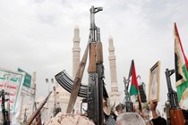 Yemenis brandish rifles, flags of Yemen and Palestine, and Houthi emblems while chanting slogans during a demonstration against Israel's latest aerial attacks to hit Yemen's port city of Hudaydah in the ongoing war on Palestine, on July 26, 2024, in Sana'a, Yemen.