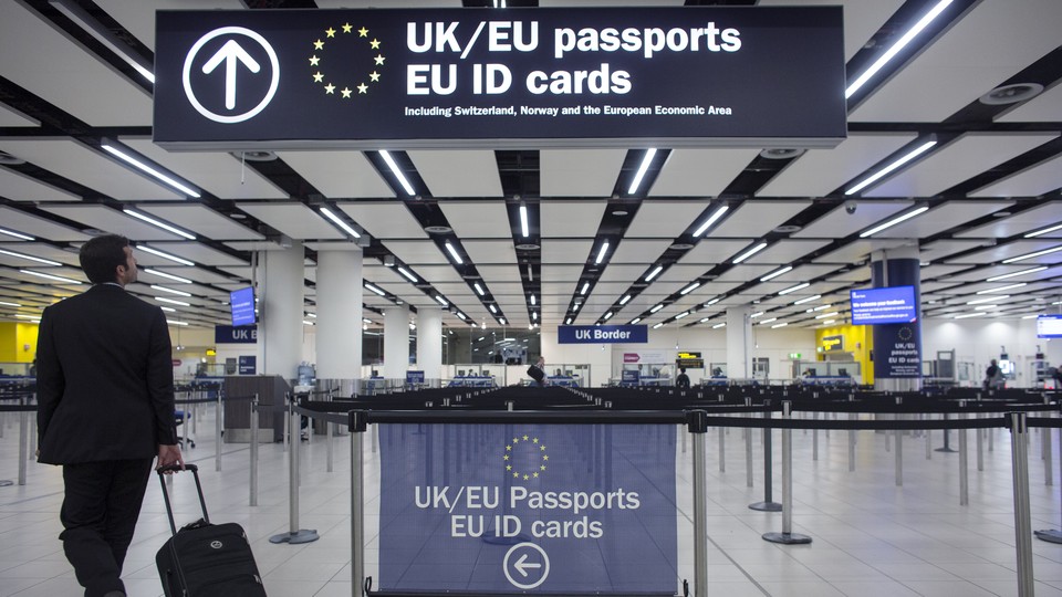 A traveler arrives at Gatwick Airport in London and approaches the line for EU passport holders.