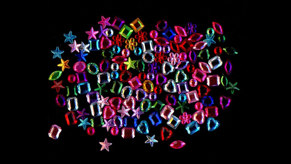 multicolor gems and stones on black background