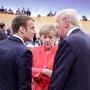 French President Emmanuel Macron, German Chancellor Angela Merkel and U.S. President Trump talk with one another. 