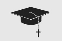 A black graduation cap with a rosary beaded-cross hanging from it.