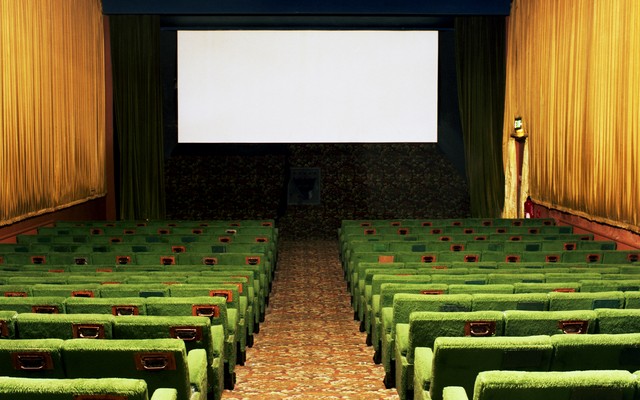 Illustration of an empty movie theater and a blank screen