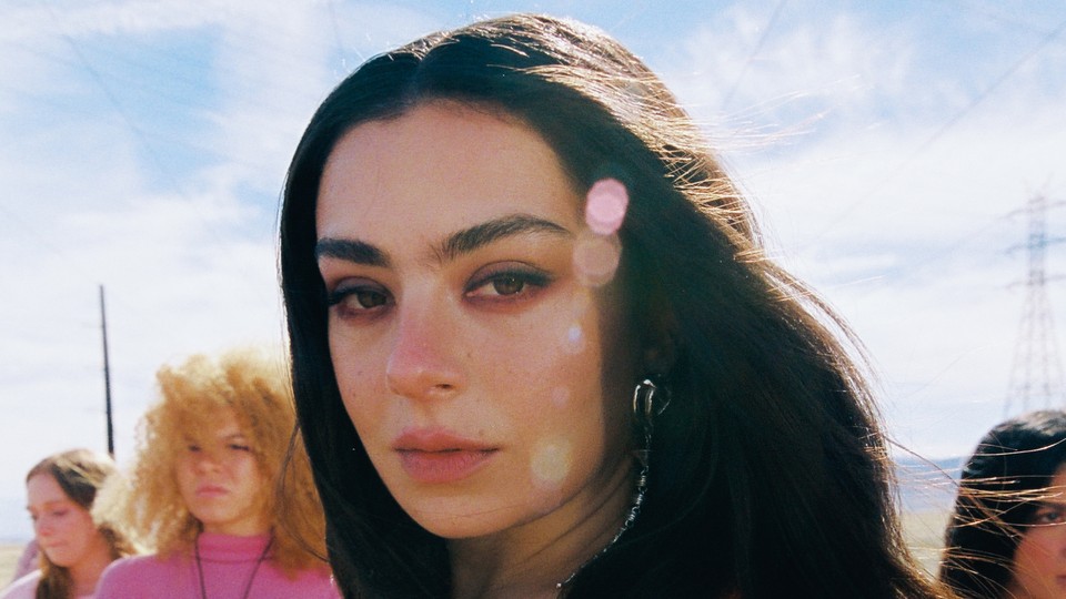 Charli XCX stares at the camera in "Beg for You"