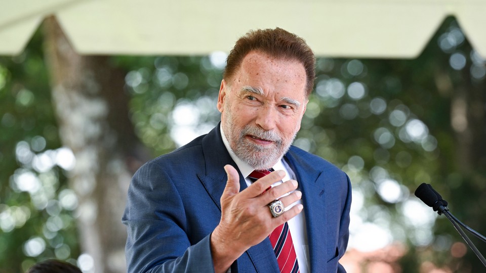 A photo of Arnold Schwarzenegger speaking at the annual naturalization ceremony at Mount Vernon.