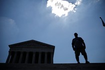 A man stands outside the U.S. Supreme Court after the Court ruling on June 27.