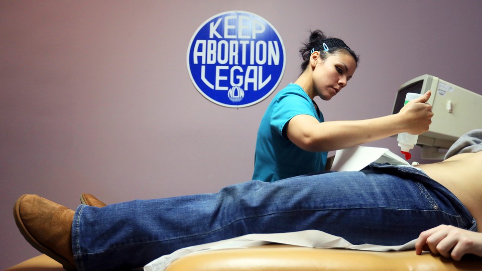 A provider performs a sonogram at the Whole Women’s Health Clinic in McAllen, Texas.