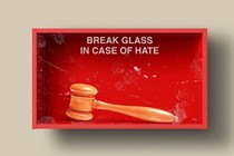 An illustration of a box that says "Break glass in case of hate" with a gavel inside