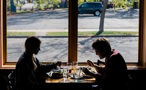 Two people dining indoors at a restaurant