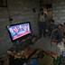 Members of the Iraqi forces watch Donald Trump giving a speech after he won the U.S. president election.