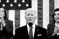 President Joe Biden is seen giving the State of the Union address with Kamala Harris and Nancy Pelosi in the background