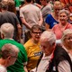 People standing in a crowded auditorium