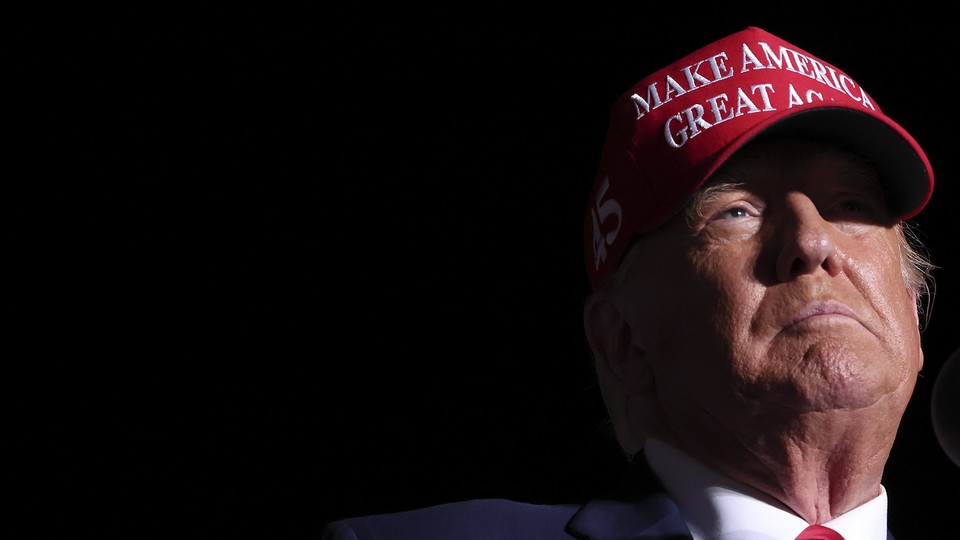 Photograph of Donald Trump wearing a Make America Great Again hat