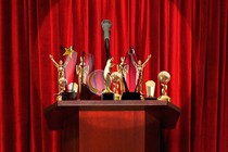 An illustration of unclaimed awards on a podium.