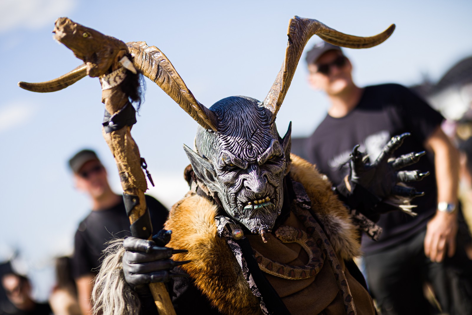 A festival-goer, dressed as a demonic Krampus character