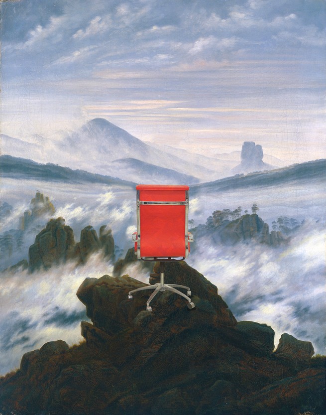 Red office chair on a mountain top