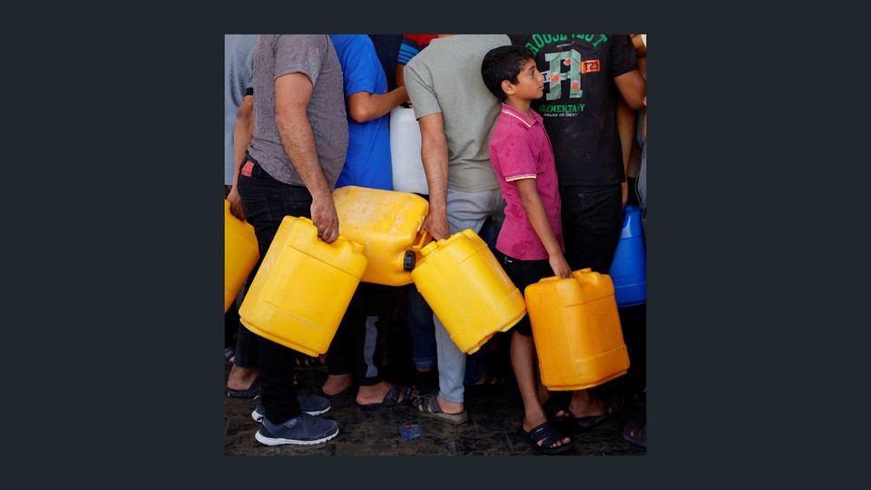 Photo of Palestinians in line for water
