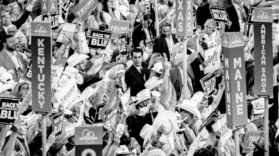 Crowds holding signs at the Republican National Convention