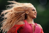 A picture of Sha’Carri Richardson with her hair flowing behind her