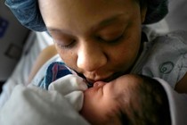 Maya Warren, 31, holds her newborn baby Kortez Isaiah Wallace at Providence Hospital in Washington, D.C., on Friday, December 2, 2016. The first time mother works as an Uber driver with no paid time off for maternity leave.