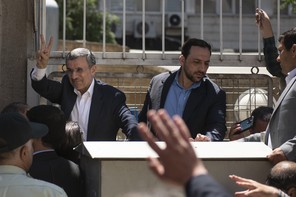 Photograph of Mahmoud Ahmadinejad flashing a victory sign to a crowd of waving supporters