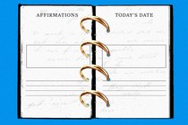 A day planner with binder rings replaced by wedding rings