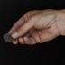 A hand holding a sample of Cobalt