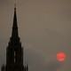 The sun sets behind the Houses of Parliament in London on October 16, 2017. 