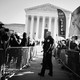 Police use metal barricades to keep protesters, demonstrators and activists apart in front of the U.S. Supreme Court