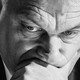 Viktor Orbán rests his head on his hand.