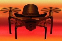 A drone wearing a cowboy hat hovers against a red sky.