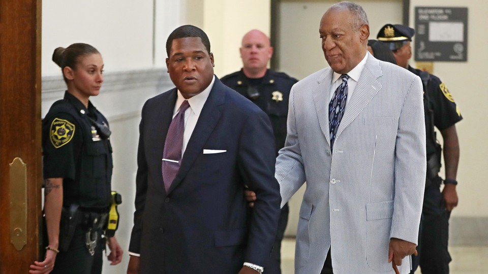 Bill Cosby is led into court