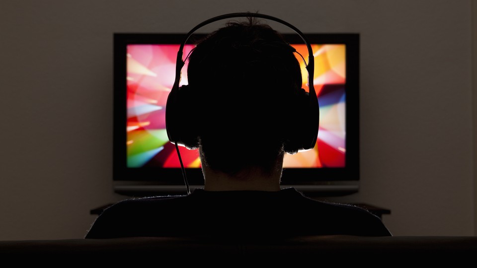 A person watching TV