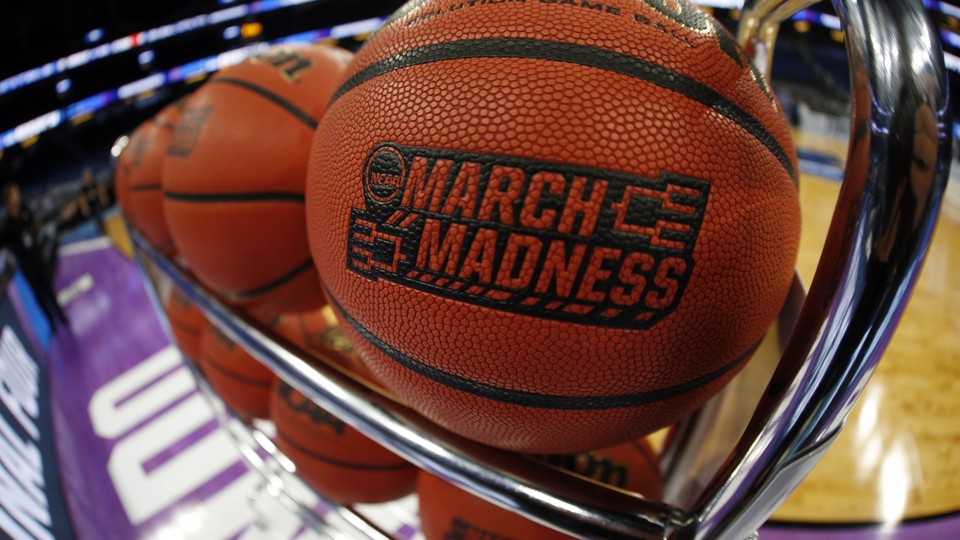 A rack of basketballs branded with the NCAA's March Madness logo