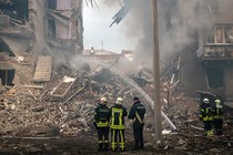 Firefighters and rescue workers at the scene of a Russian missile strike on Zaporizhzhya, Ukraine