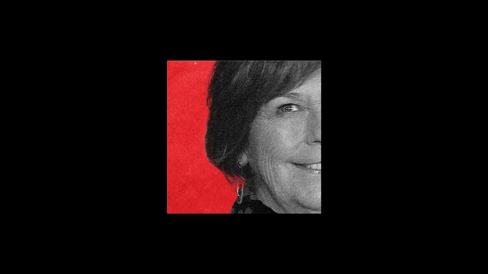 A partial image of Nancy Guthrie against a red background, surrounded by a black box