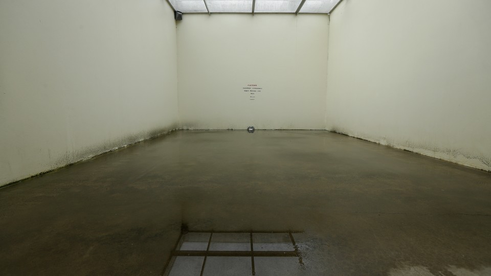 A drab, empty room within a corrections center in Washington state.