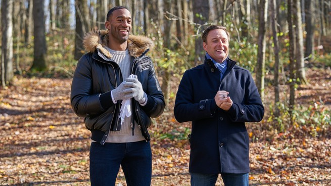 Matt James and Chris Harrison standing in a forest together