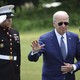 U.S. President Joe Biden waves as he returns to the White House