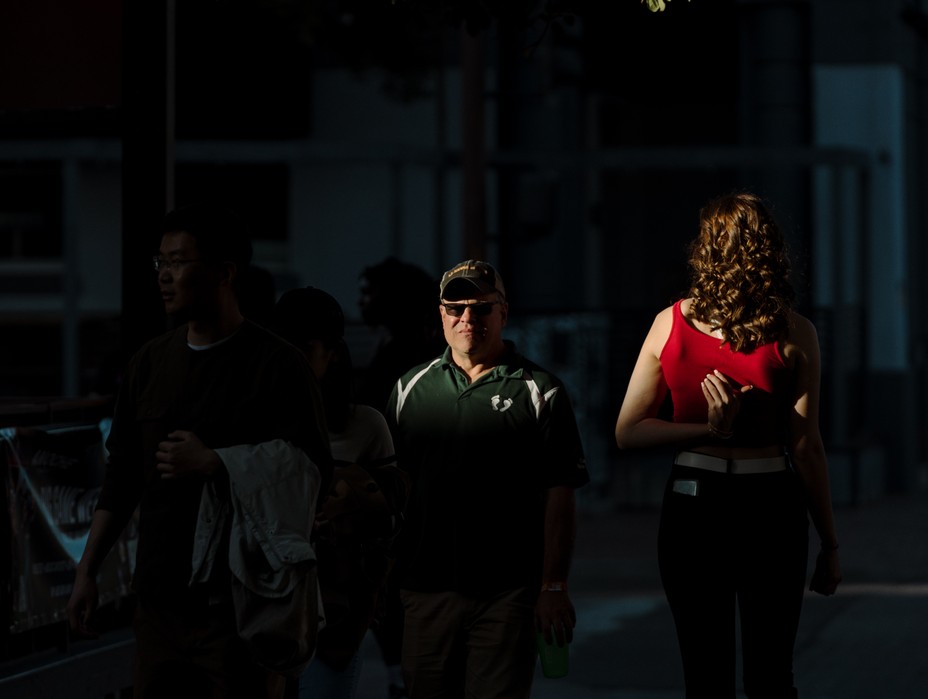 Picture of pedestrians walking along Mill Avenue in Tempe, AZ.