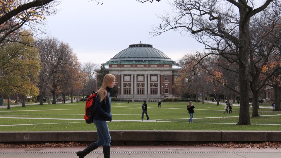 Students walk across the campus of the University of Illinois at Urbana-Champaign.
