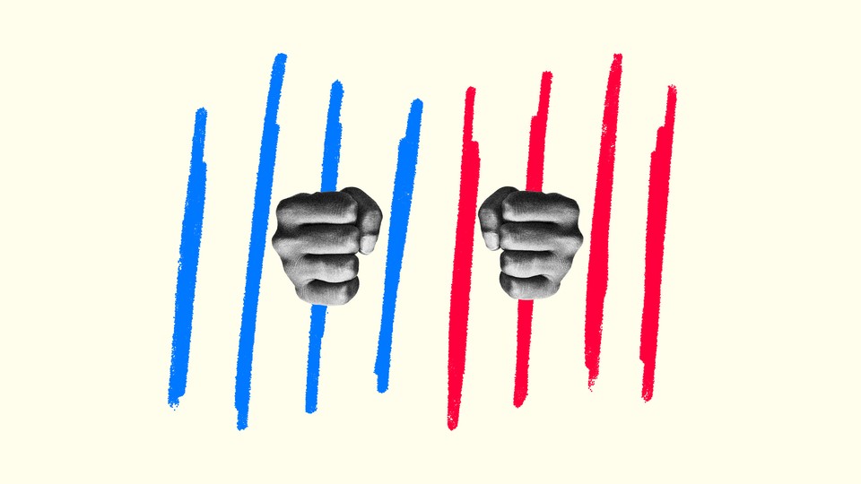 A pair of hands gripping red and blue bars