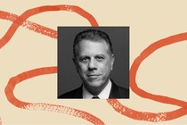 A photo of Michael Waldman, surrounded by an illustrated border