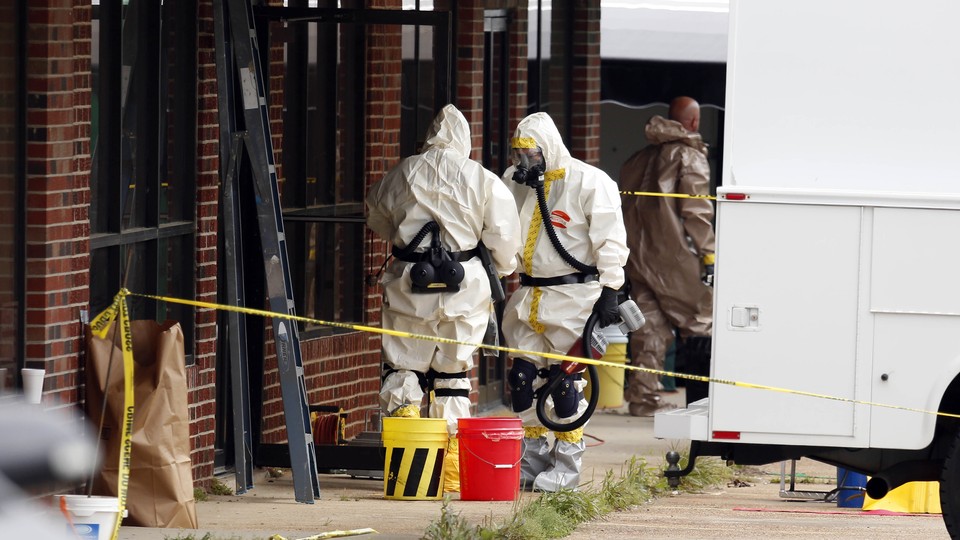Authorities search the studio of man who sent the 2013 ricin letters.