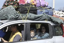 Picture of Palestinians fleeing to safer areas following Israeli air strikes