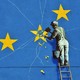 A Banksy mural depicting an EU flag being chiseled by a workman
