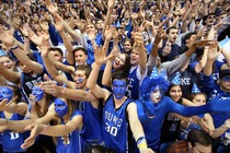 Fans with blue face paint and spirited outfits cheer on the Duke Blue Devils.