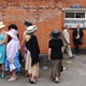women wait in line for the bathroom