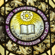 A stained-glass window depicting the Amherst College seal